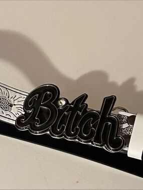 Bi##h Belt Buckle with white and black tooled leather belt size 36 to 39”